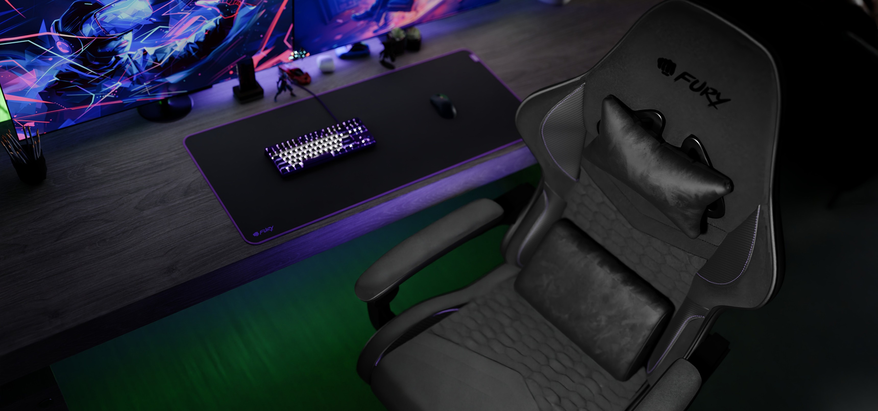 Gaming chair beside a keyboard and mouse pad on a sleek desk with colorful lighting.