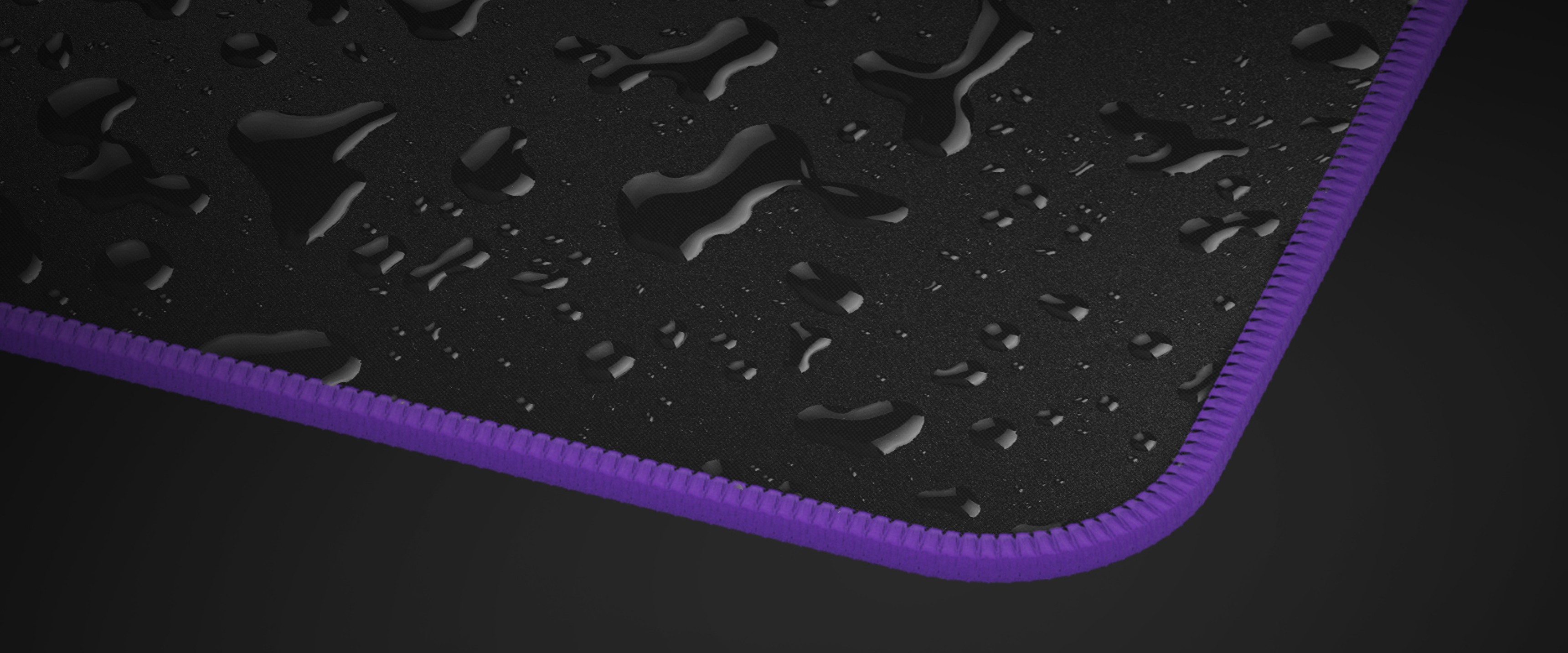 Black gaming mouse pad with a water-resistant surface and purple stitched edges, measuring 400x300mm
