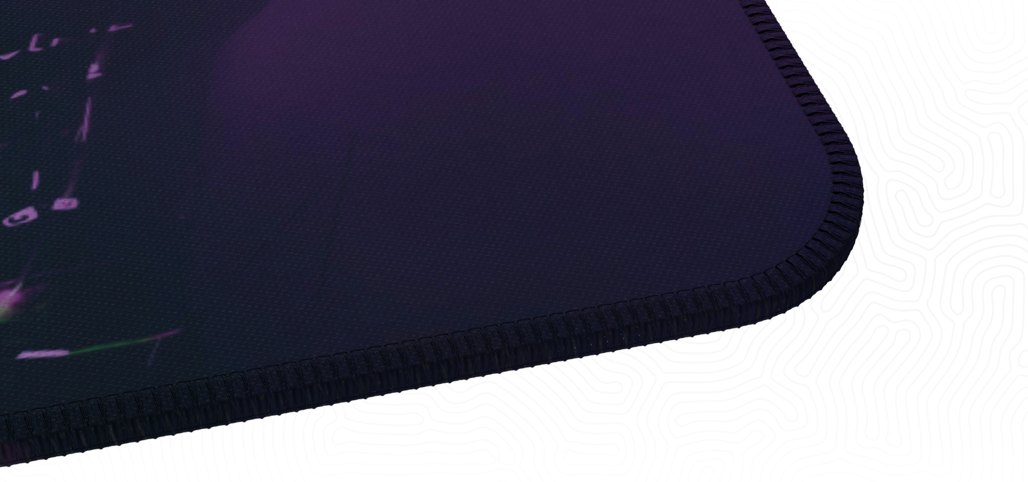 Close-up of a gaming mouse pad with a textured edge and a dark gradient design.
