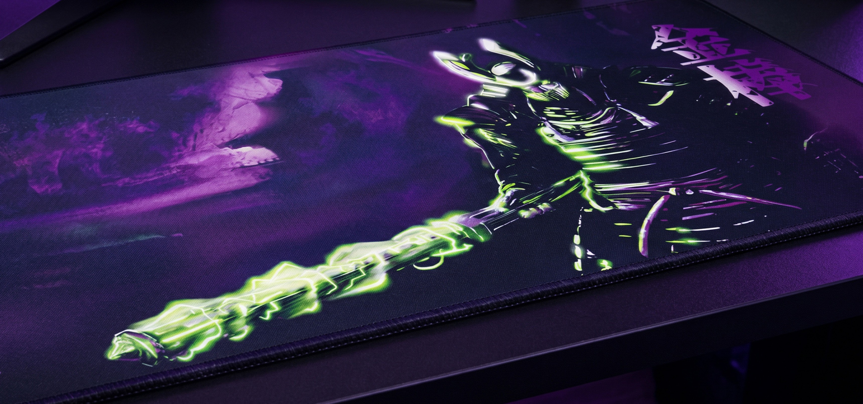 Mouse pad featuring a glowing weapon design and a character depicted in vibrant colors.