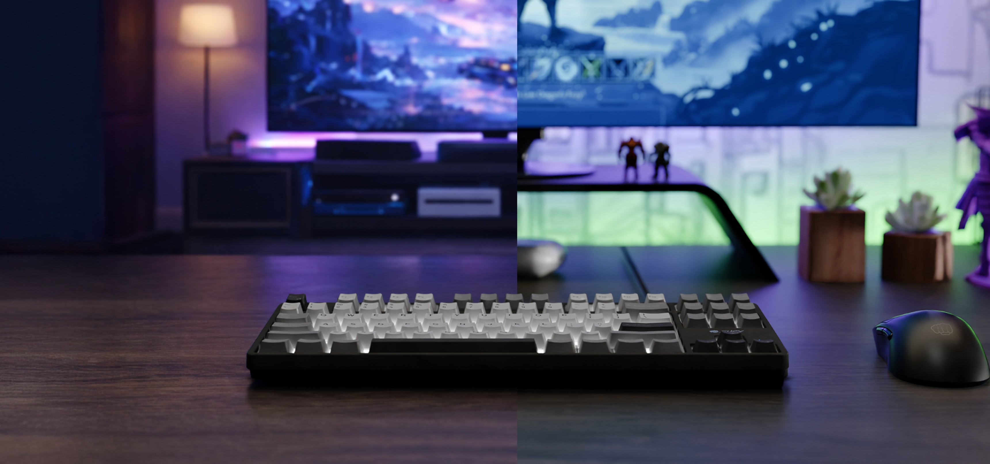Keyboard on a wooden desk with a mouse and colorful screens in the background.