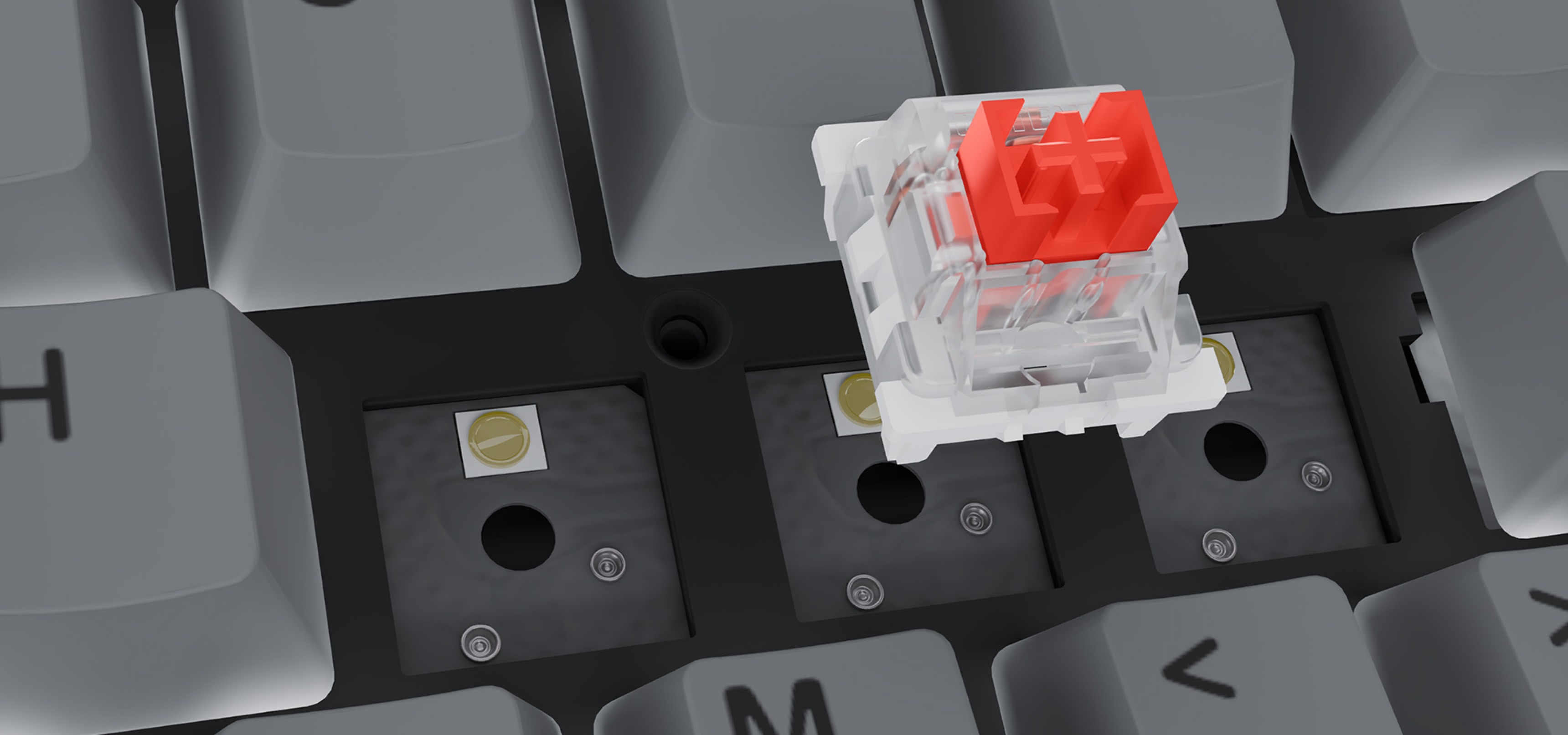 A close-up view of a mechanical keyboard switch above a key slot on a keyboard.