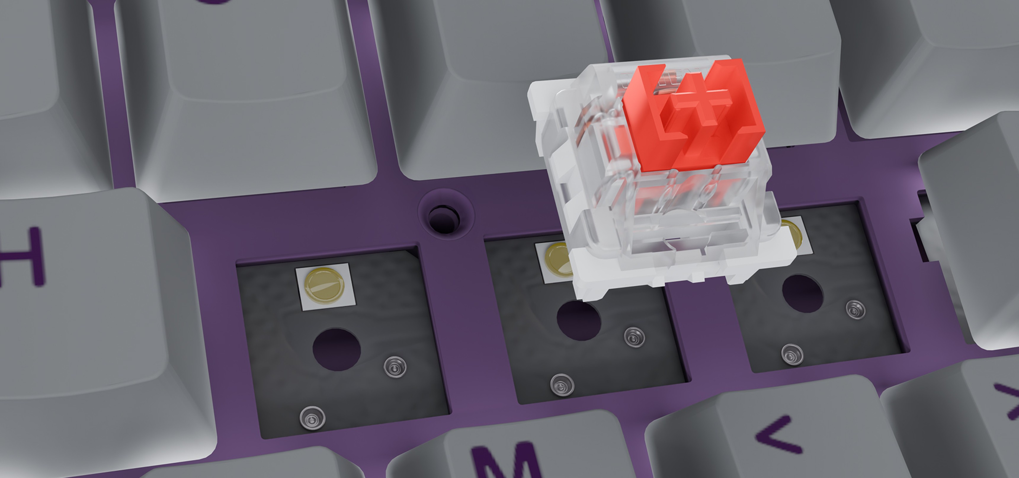 Red mechanical key switch positioned above a purple keyboard with exposed key slots.